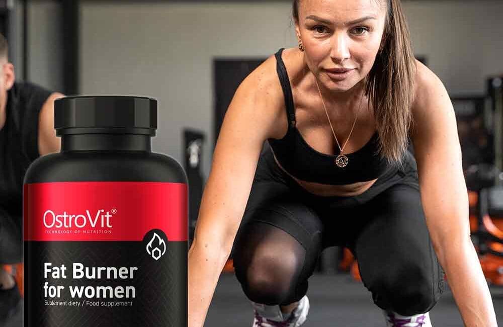 OstroVit Fat Burner for Women - 60 capsules bottle. The product is in a sleek, modern design with a vibrant label showcasing its name and key benefits. The bottle is surrounded by ingredients such as green tea leaves, coffee beans, and African mango seeds, highlighting the natural components used in the supplement."